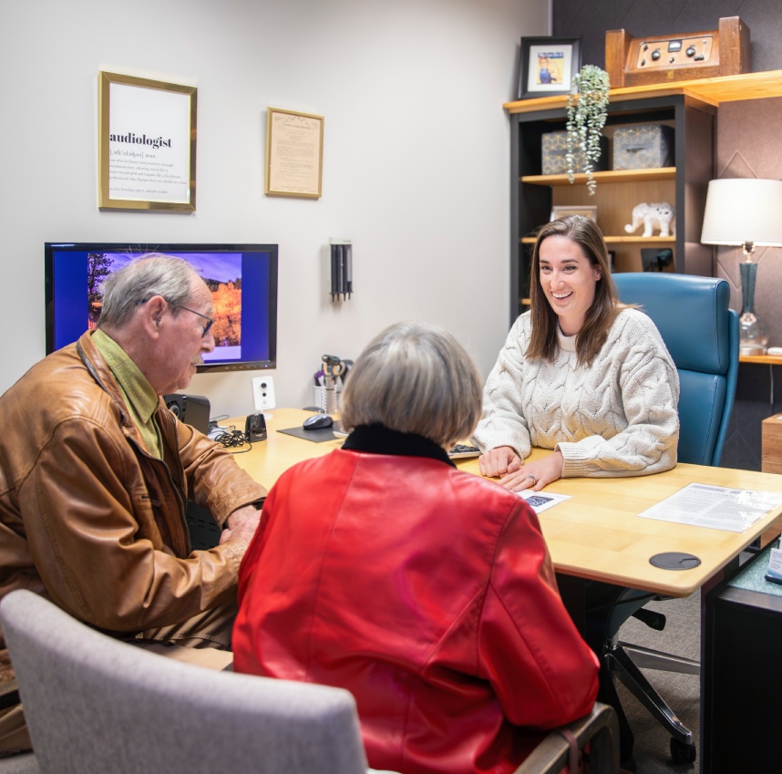 A doctor discussing items on a clipboard with a patient