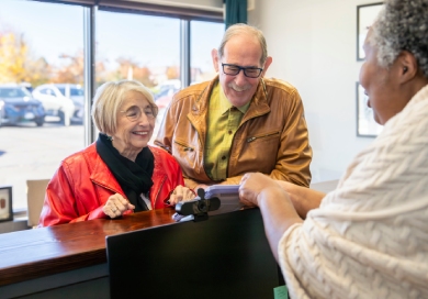 Elderly couple booking appointment